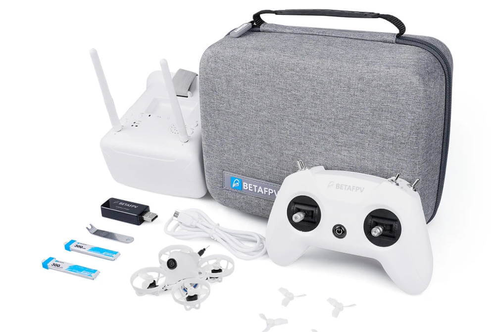 FPV racing drone starter kit with controller and goggles all in white colors.