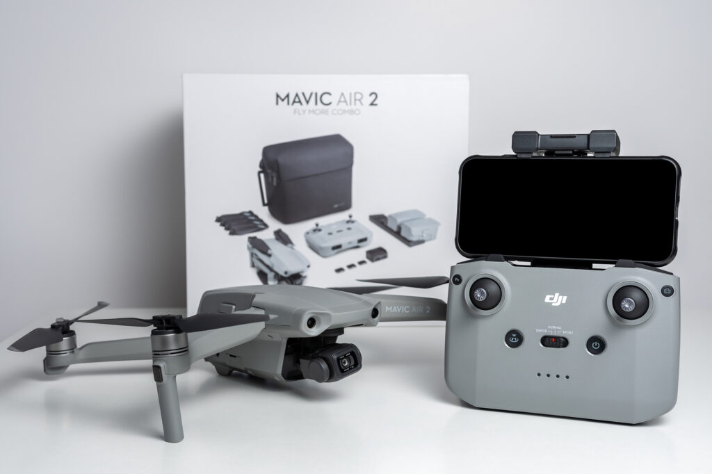 DJI Mavic Air 2 quadcopter with remote control on a white background.